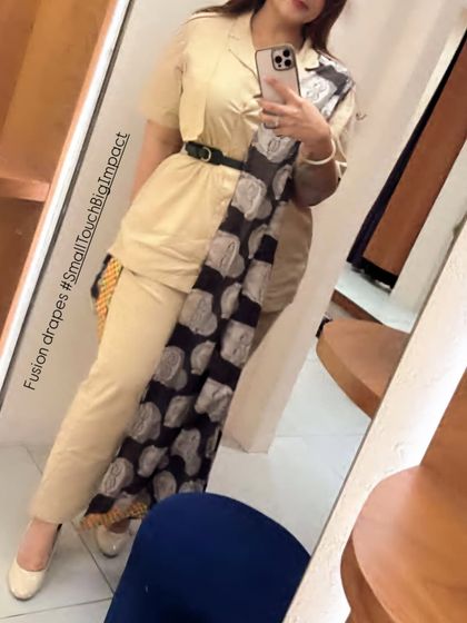 A closer look at the fusion drapes. The way a dupatta is belted and styled can completely change the silhouette and impact of an outfit, making it a powerful styling tool.