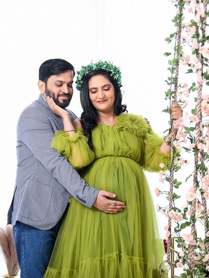 A sweet and candid moment between the couple on our floral swing. The lime green gown adds a fresh and vibrant feel to this romantic shot.