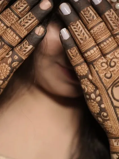 I specialize in personalizing your mehendi. Here, I've woven the couple's initials 'A' and 'V' into a traditional design, making it a unique symbol of their union.