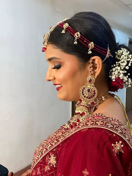 The complete look for this stunning bride, showcasing her radiant smile and the flawless makeup that will last through all the wedding day festivities.