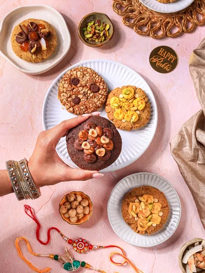 Adding a human touch makes food feel more relatable and alive. This flatlay for a Rakhi cookie collection uses hands to create a sense of sharing and connection, telling a story beyond just the product.