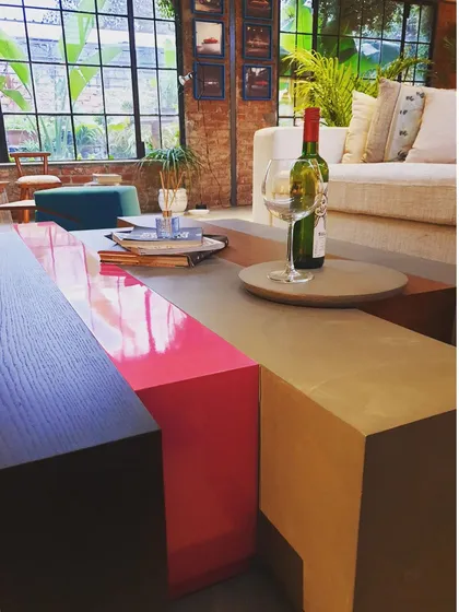A playful and modular coffee table we designed for our studio space. Composed of several blocks in different colors and finishes, it can be rearranged to create different forms, showcasing our love for versatile and creative furniture.