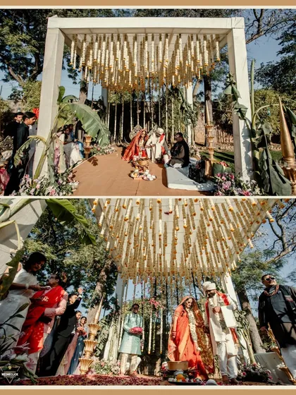 The couple taking their pheras under a beautiful mandap decorated with hanging floral arrangements. This shot captures the essence of the Hindu wedding ritual.