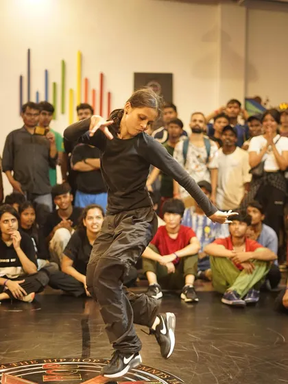 A b-girl shows her style and flow during a battle. Our events are a space where female dancers can confidently showcase their skills and artistry.