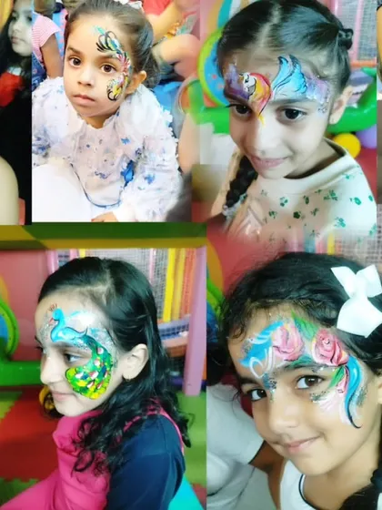 A gallery of some of my most popular face painting designs for kids, such as skulls, parrots, peacocks, and floral patterns.