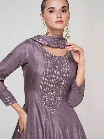 This dusty purple premium silk gown is modern and chic. The unique neckline and subtle sequin work make it a sophisticated choice for any formal event.