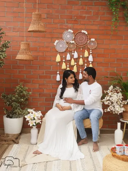 A sweet moment of connection as they sit together in the cozy corner. The white dress and his white shirt create a clean and classic look.