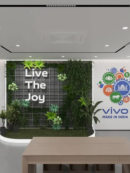 A 3D render of a Vivo store interior featuring a "Live The Joy" green wall. This concept was designed to be a photo opportunity spot for customers, enhancing their in-store experience.