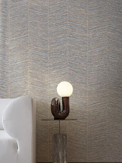 Gracefully sloping bamboo forms a bold herringbone pattern in this design from Jannelli & Volpi. The vertical grooves and geometric elegance infuse the surface with depth, rhythm, and vitality.
