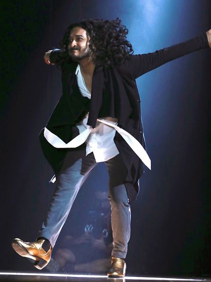 A full-body shot of a solo performance, capturing the energy and flow of the dance.