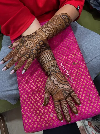 Both hands of the monogrammed bridal design, showing the complete and symmetrical artwork.