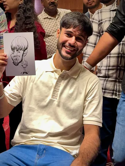 The smiles say it all. This guest is clearly happy with his exaggerated, fun portrait.