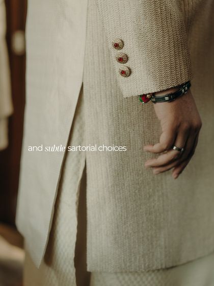 It's all in the details. A close-up of the groom's sherwani, showing the textured fabric and custom buttons that elevate the entire look.