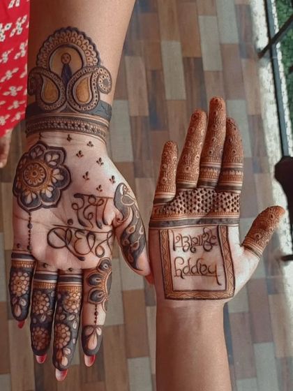 A personalized Rakshabandhan design with "Rakhi Bandhan" written in beautiful calligraphy on one hand and "Happy Rakshabandhan" on the other.