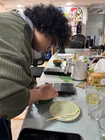 Precision is key in beverage making. Here, a student in our Matcha Masterclass learns the importance of accurate measurements for a balanced drink.