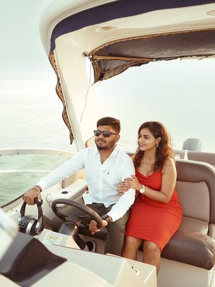 A playful shot of the couple at the helm of the yacht. Themed shoots like this are about creating an experience, not just taking photos.