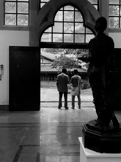 A moment of quiet contemplation with friends inside the halls of Sir J.J. School of Art.