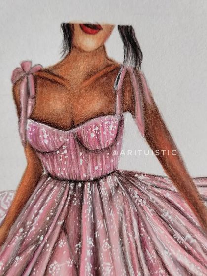 A close-up of the bodice and upper portion of the pink dress, highlighting the delicate straps and texture.