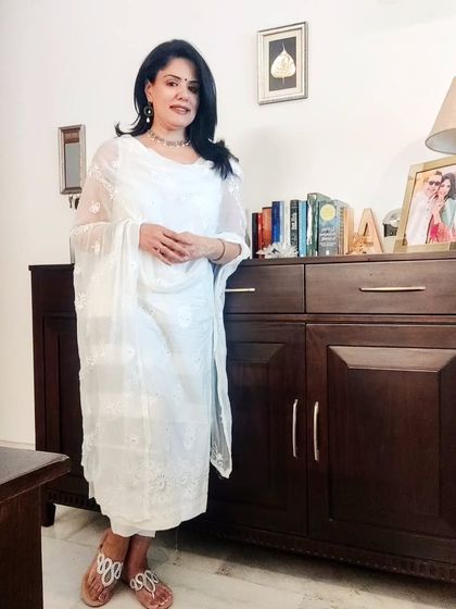 In this scorching Delhi heat, I love bringing out my whites. I wore this embroidered white-on-white kurta set for a friend's visit, paired with a silver choker and earrings.