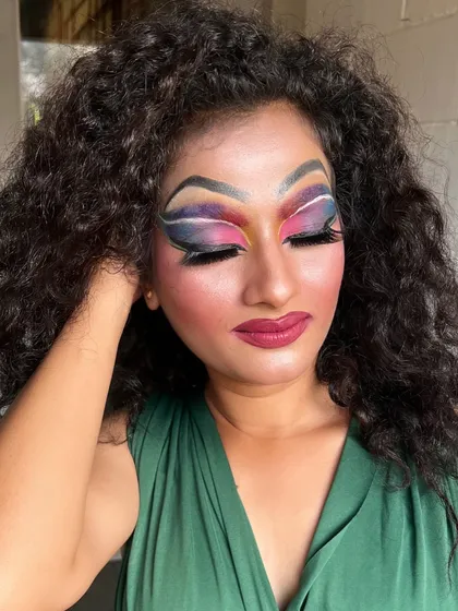 A close-up of the intricate eye makeup in the drag look, with multiple colors blended to perfection.