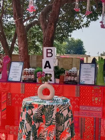 A vibrant and colorful bar setup for a daytime Mehendi function, showing our versatility for both indoor and outdoor events.