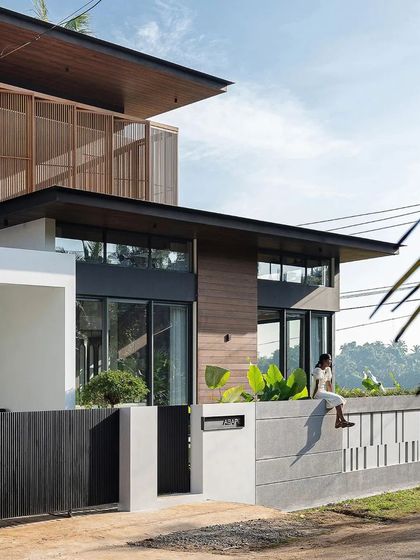 The design thoughtfully provides spaces for informal interaction, like this boundary wall where one can sit and engage with the street.