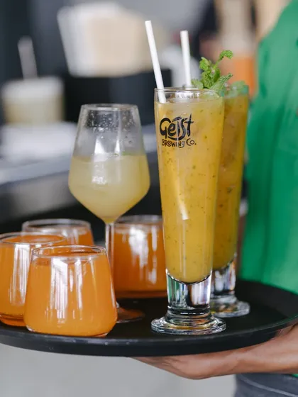 A tray full of sunshine. Our staff is ready to serve up a round of fresh juices and smoothies for your table.