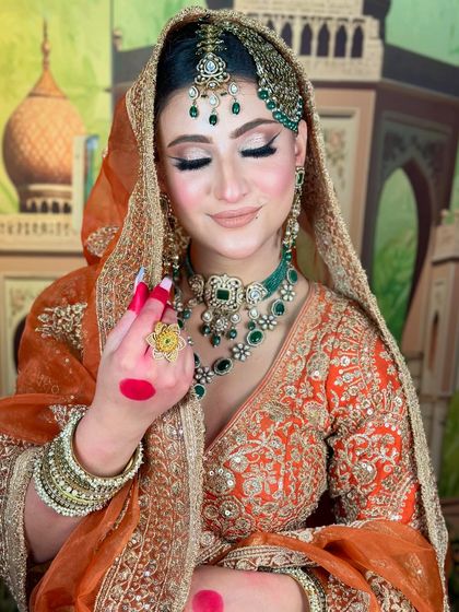 A soft, dreamy shot of the bride. The nude lipstick and shimmery eyes are modern touches to a traditional look.