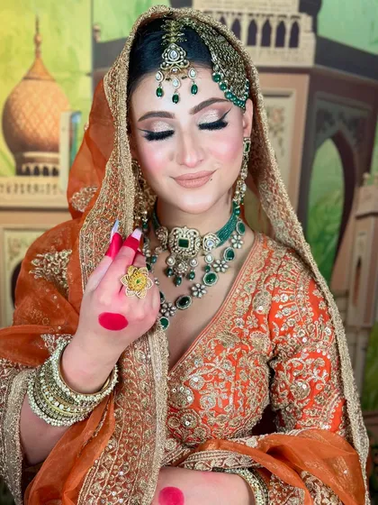 A soft, dreamy shot of the bride. The nude lipstick and shimmery eyes are modern touches to a traditional look.