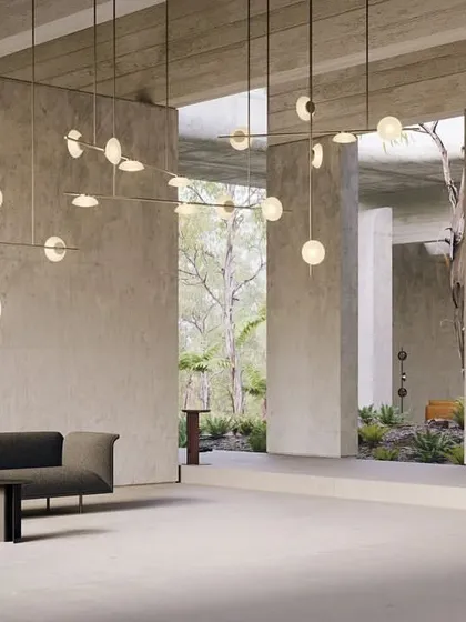 A grand Ceto installation in a spacious, minimalist living area. The fixture fills the vertical space and acts as a piece of architectural art, defining the entire room.