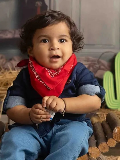 A close-up of our little cowboy, full of curiosity and charm.