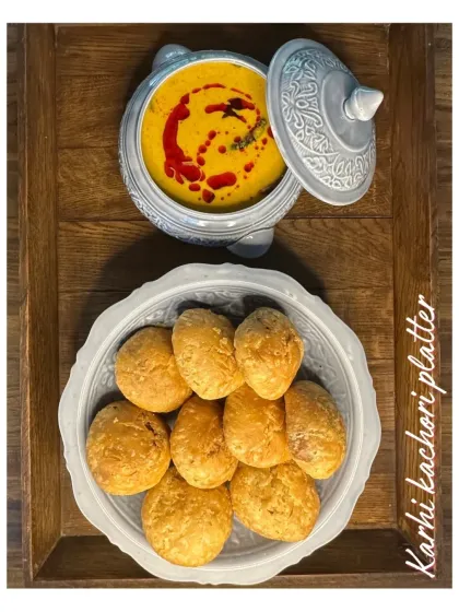 My Karhi Kachori platter features flaky kachoris served with a tangy and spicy yogurt-based curry. It's a traditional Rajasthani snack that I love to prepare for festive gatherings.
