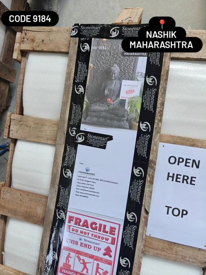 Another angle of a packed crate, showing the "Fragile" and "Open Here" labels that guide the delivery and unpacking process.