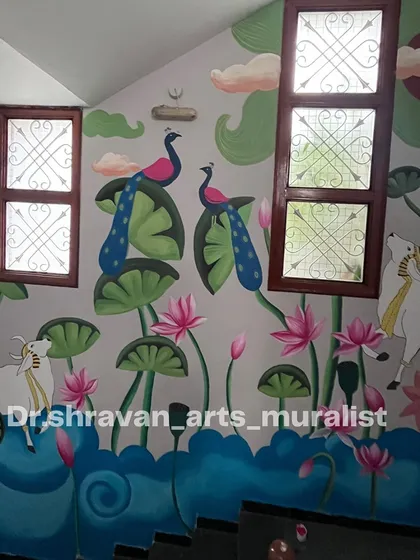 Even a staircase wall with windows can become a canvas for a beautiful Pichwai story. This mural incorporates the architecture seamlessly, with peacocks, cows, and lotuses creating a heavenly scene.