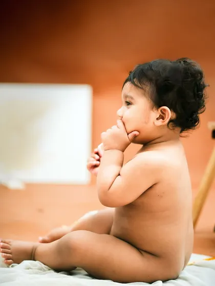 A thoughtful moment with a paintbrush in hand. This session was all about capturing his natural curiosity.