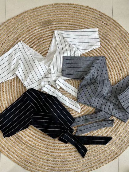 My designer V-neck blouse in pure cotton with classic stripes, available in black, grey, and white.