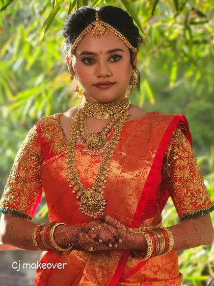 A full-length view of Archana's wedding look, showing how the makeup, saree, and jewelry come together for a stunning traditional appearance.