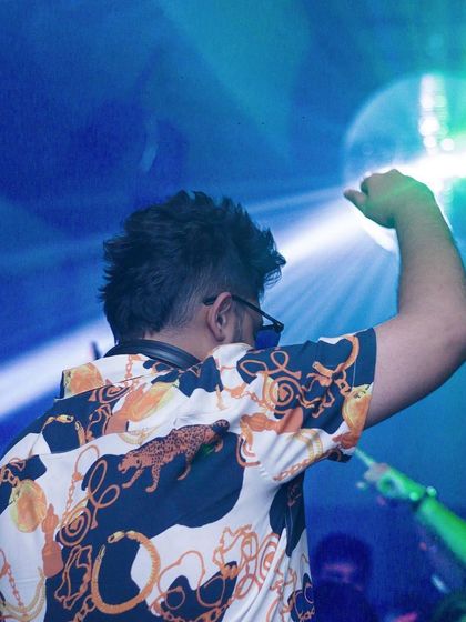 Hand in the air, feeling the music.