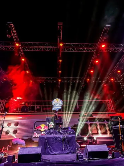 Performing on the iconic Red Bull Tour Bus in Delhi. The unique stage setup and massive lighting rig made for an unforgettable night.