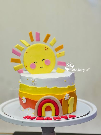 Another view of the adorable sunshine cake, perfect for celebrating a little ray of sunshine.