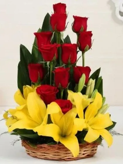 Brighten any occasion with this stunning flower basket arrangement. It combines the elegance of red roses with the cheerful charm of yellow lilies, creating a vibrant and eye-catching gift suitable for birthdays, congratulations, or get-well-wishes.