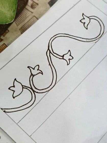 The basic vine structure for the border. We start with this simple flowing line and build upon it.