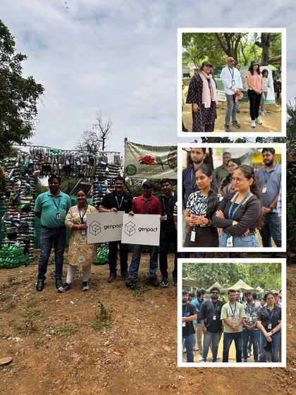 The Genpact team proudly stands with their company banner in front of a structure made from recycled plastic bottles, showcasing a commitment to both planting and waste management.