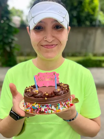 We believe every achievement, big or small, deserves a celebration. Here's one of our members celebrating her birthday with a post-run cake cutting, because we're a family that sweats and celebrates together.