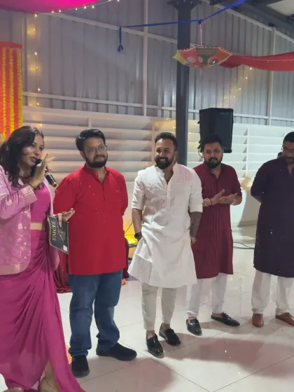 Interacting with participants on stage during the Vyapar corporate party. I make sure to give everyone their moment in the spotlight, creating a fun and inclusive atmosphere.