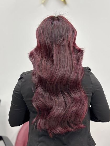 Another back view of the plum red color, demonstrating the rich and consistent pigment from root to tip.