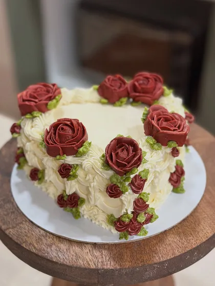A classic heart-shaped cake, perfect for anniversaries or just to show someone you care. I hand-piped each deep red rose and the delicate basketweave texture using buttercream for an elegant finish.