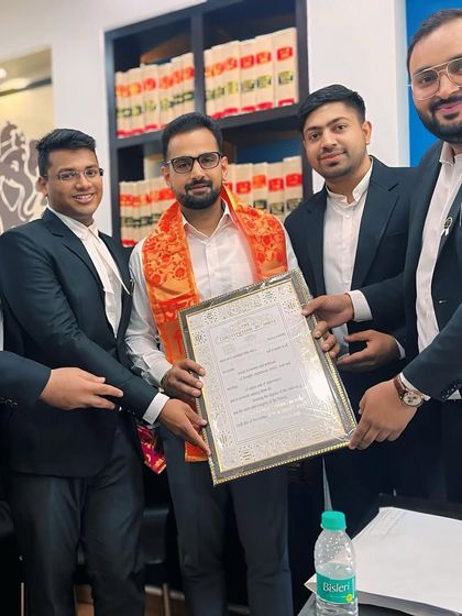 Presenting a certificate of appreciation to the newly elected Secretary of the Rohini Court Bar Association with my team.