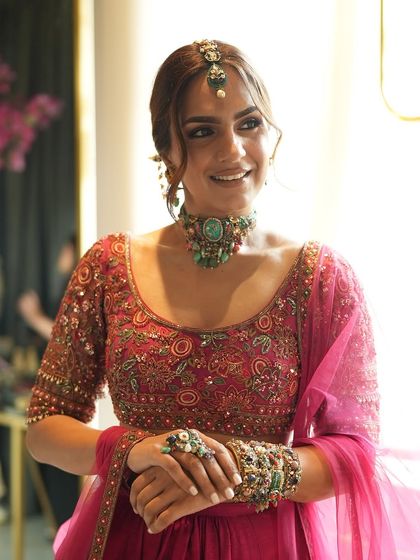 A final look from our collaboration with Purab Paschim and Ridhi Mehra. The combination of the vibrant fuchsia lehenga and the eclectic, multi-colored jewelry created a stunning look for Mehendi inspiration.