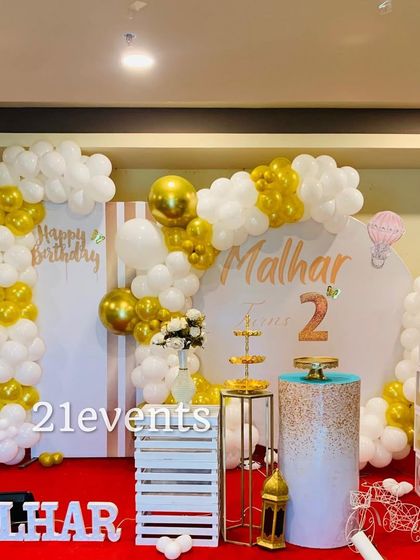 A classic white and gold theme for a 2nd birthday, showing that this elegant style works for all ages.